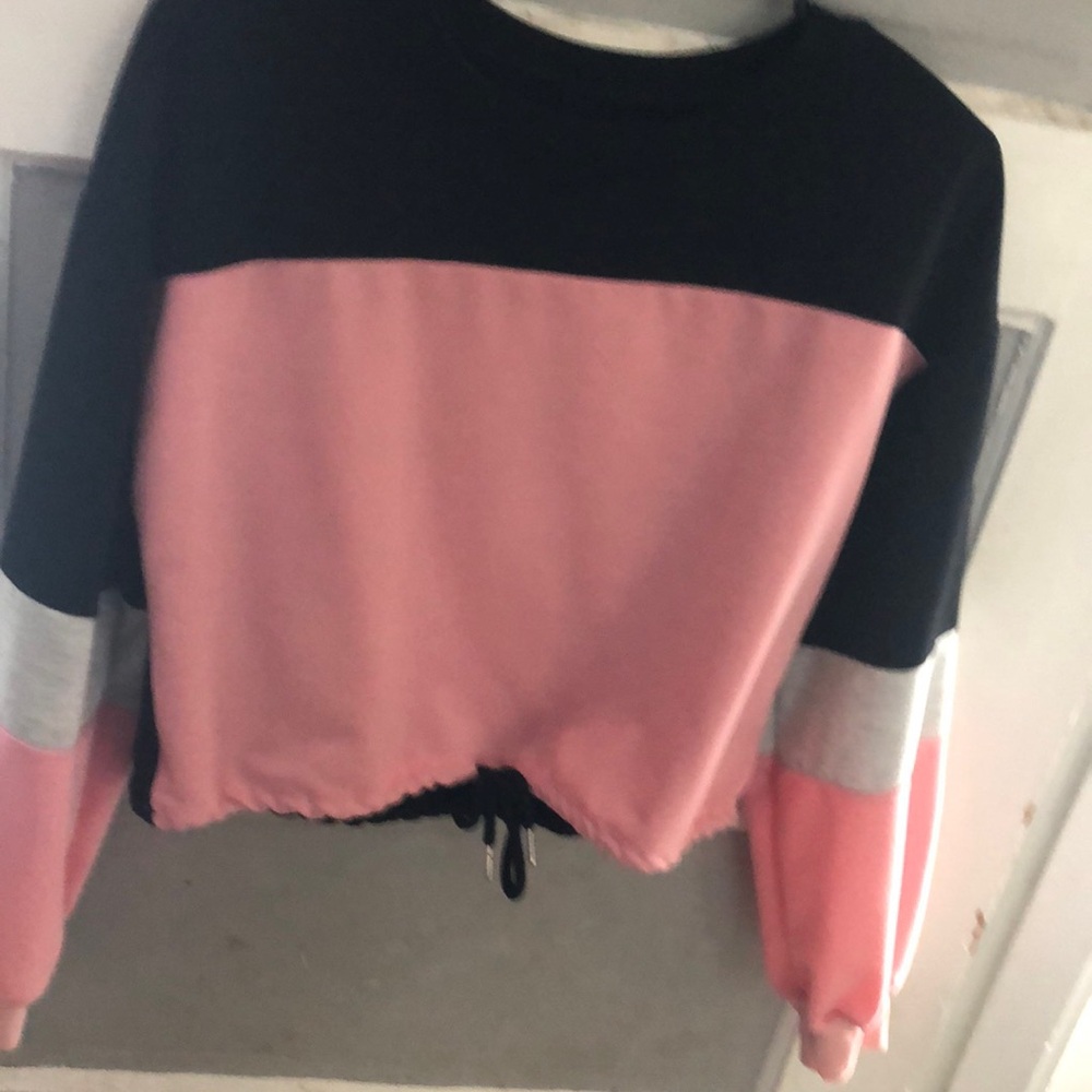 I am selling a Long sleeve belly shirt sweater